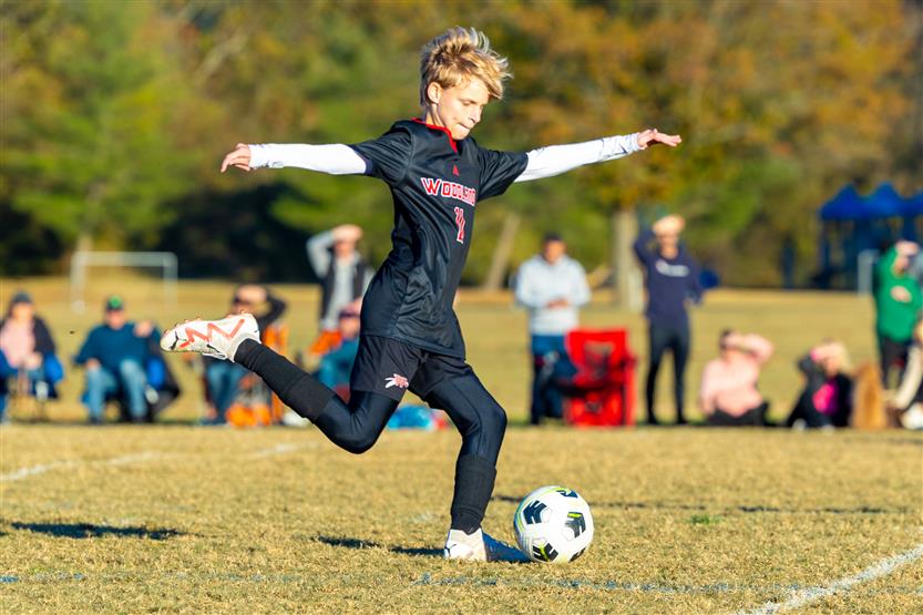 Middle school students play soccer